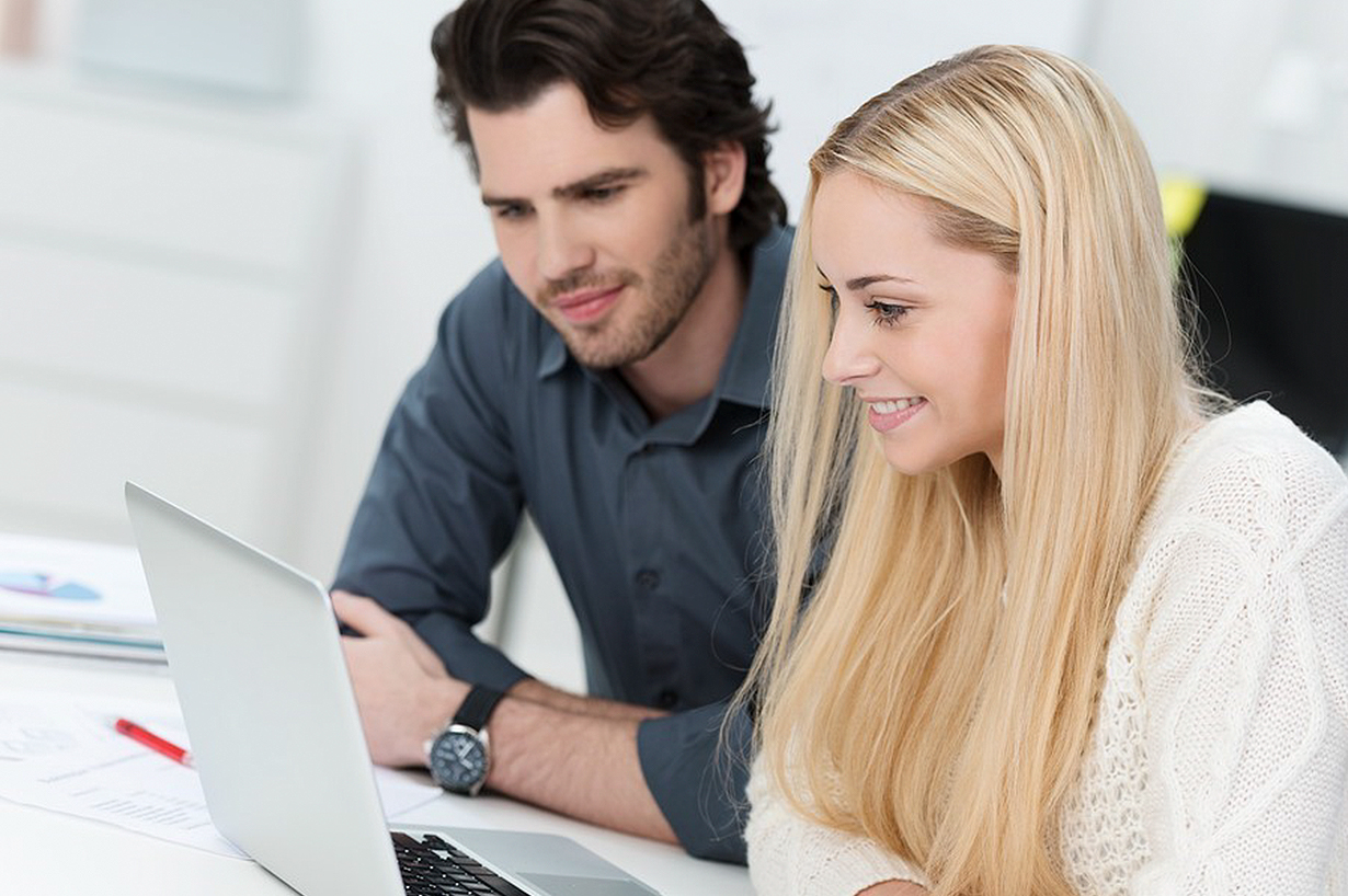 two persons working in an office