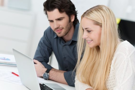 two persons working in an office