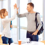 Two person doing a high five