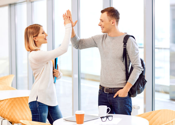 Two person doing a high five